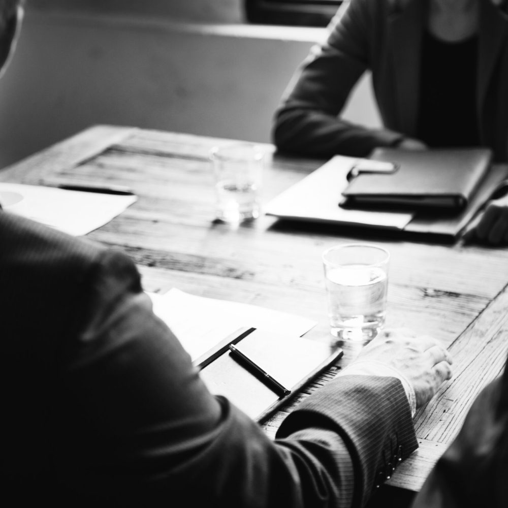 Business people sat in a meeting Business people in a meeting